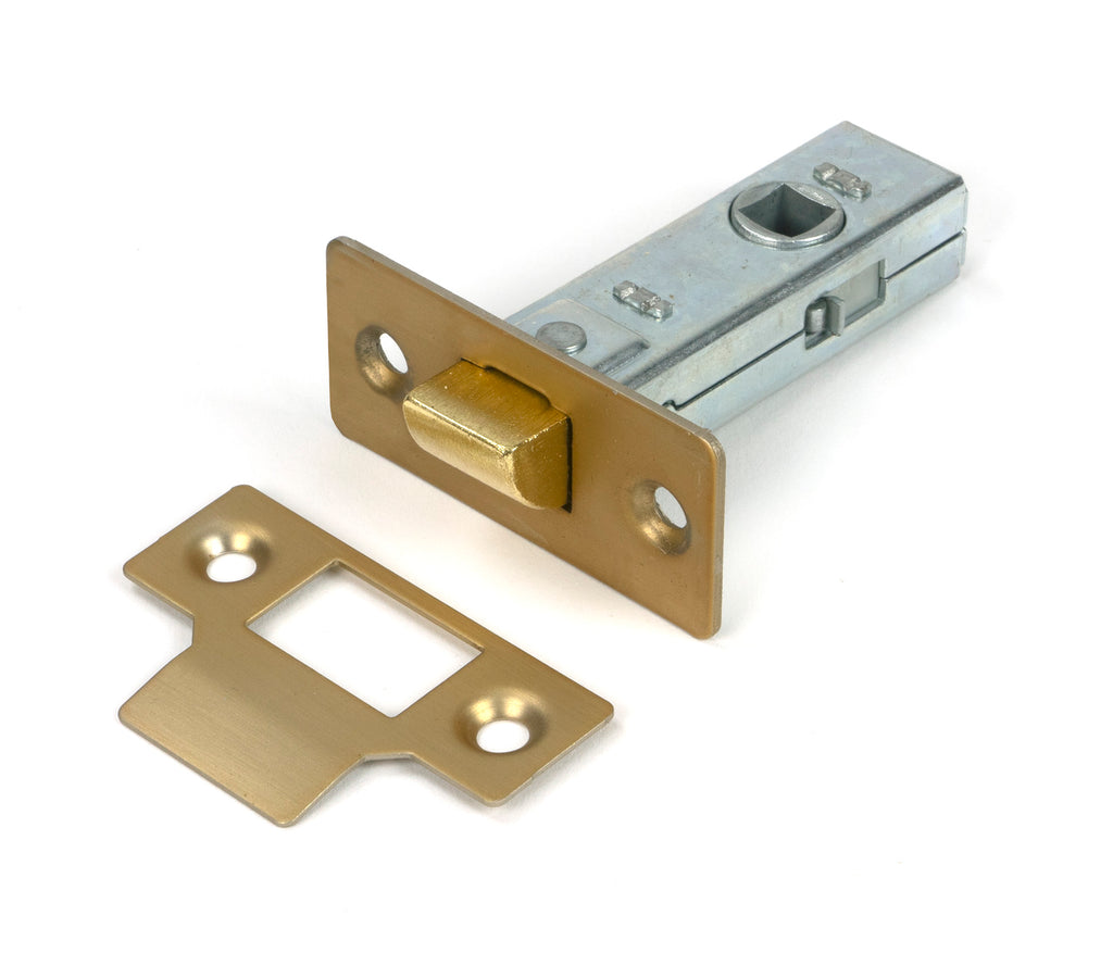 White background image of From The Anvil's Satin Brass 2½" Tubular Mortice Latch