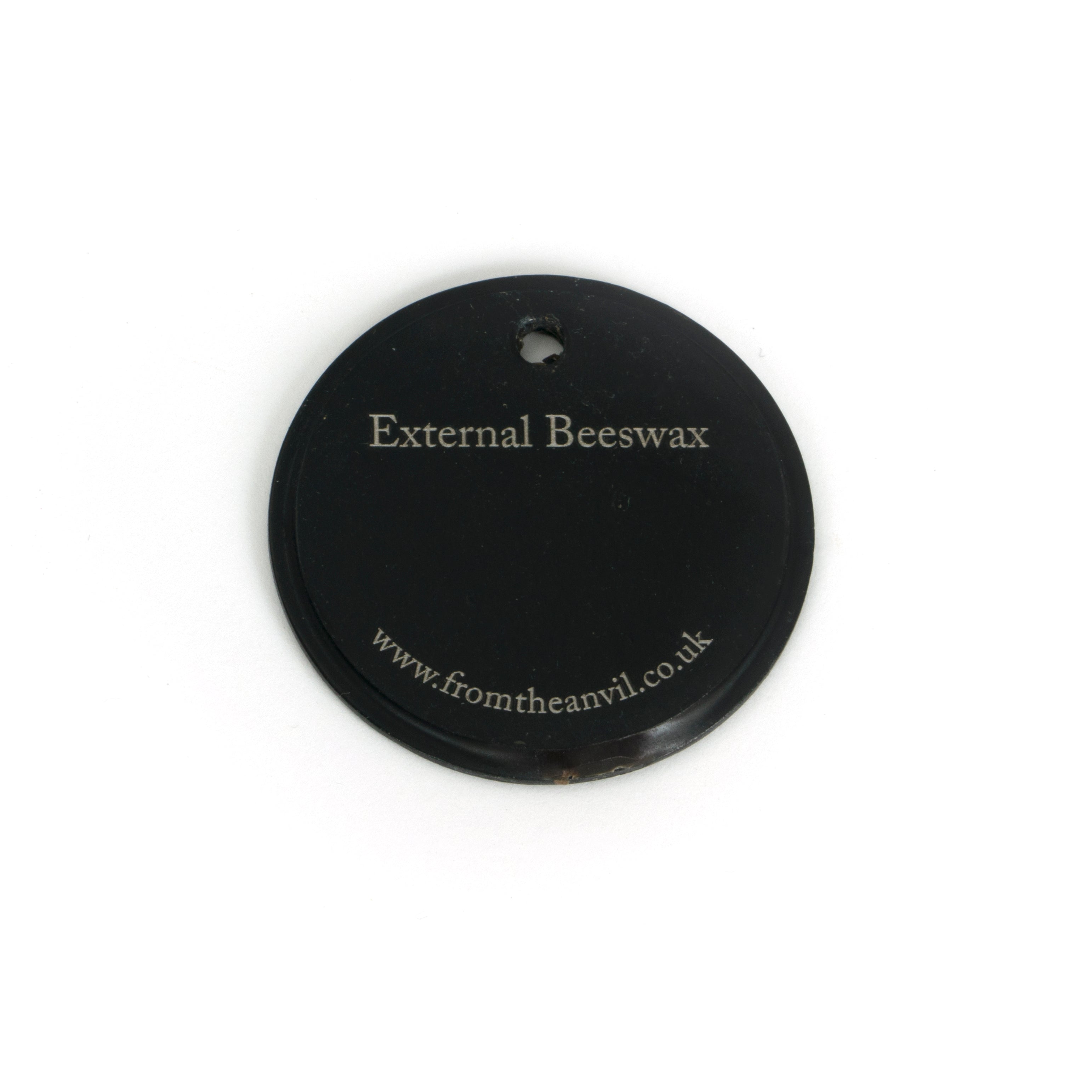 White background image of From The Anvil's External Beeswax finish swatch