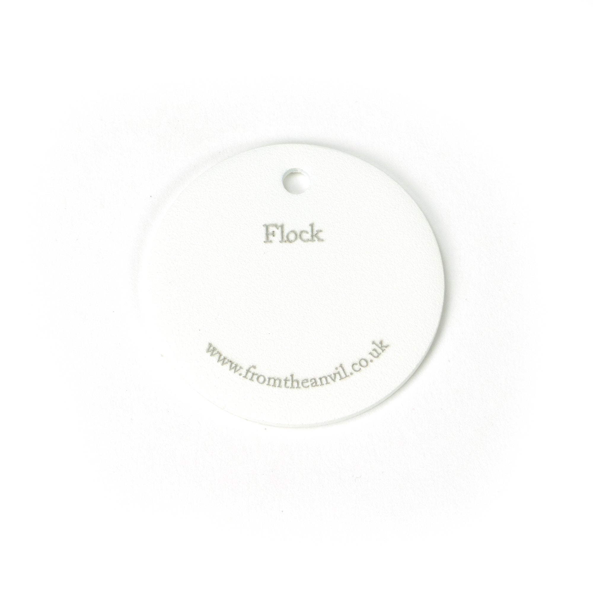 White background image of From The Anvil's Flock finish swatch