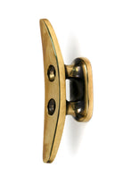 From The Anvil's Aged Brass Marine Cleat Hook
