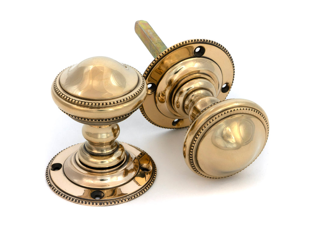 From The Anvil's Aged Brass Brockworth Mortice Knob Set