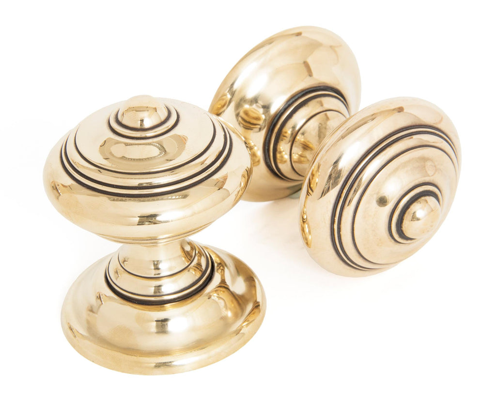 White background image of From The Anvil's Aged Brass Elmore Concealed Mortice Knob Set | From The Anvil