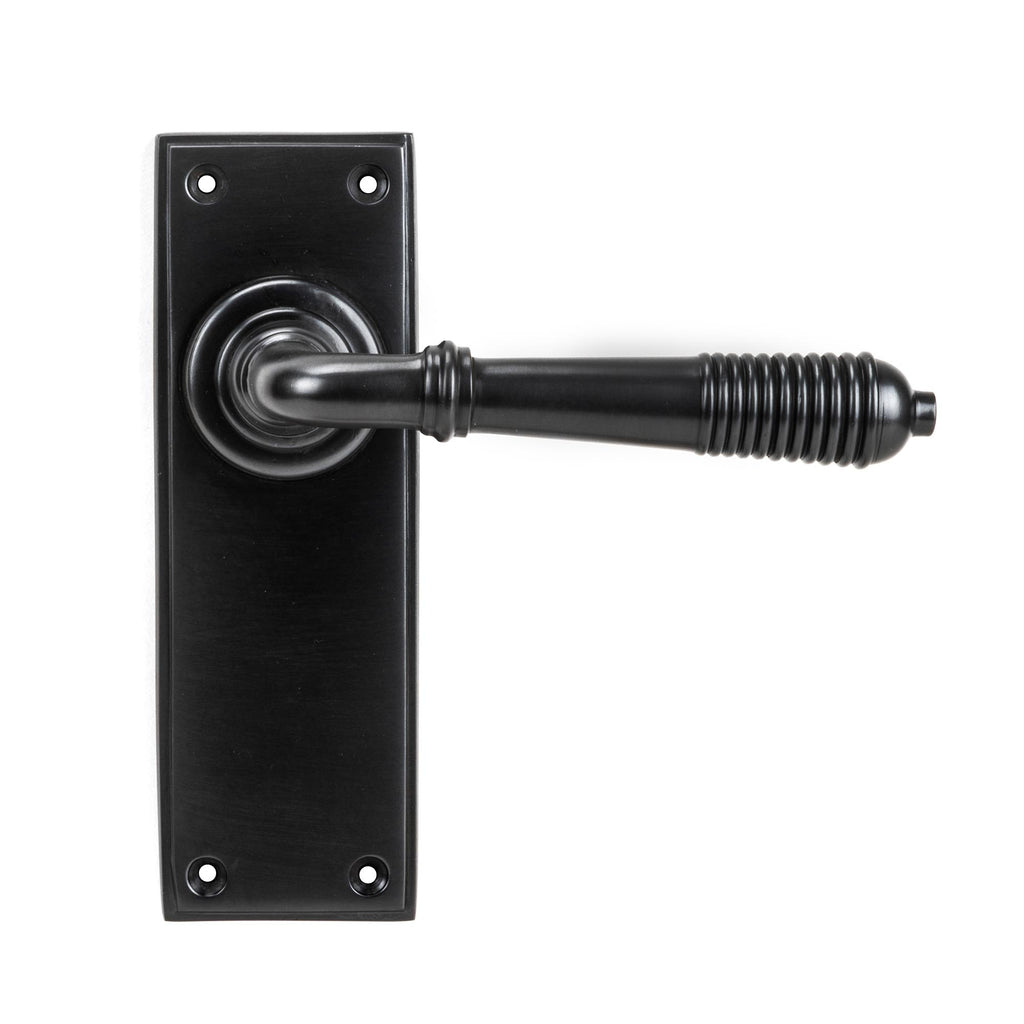 White background image of From The Anvil's Aged Bronze Reeded Lever Latch Set | From The Anvil