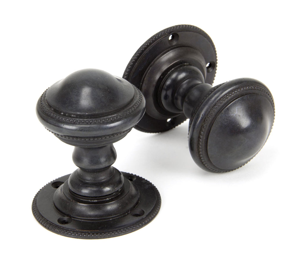 White background image of From The Anvil's Aged Bronze Brockworth Mortice Knob Set | From The Anvil