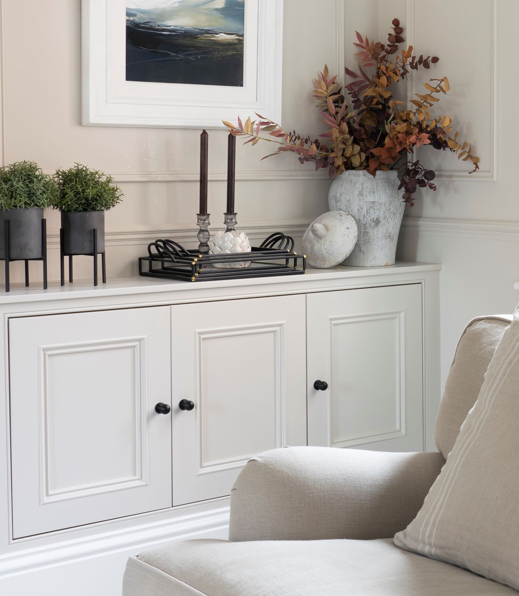 Cream panelled cupboards with Aged Bronze From The Anvil cabinet knob handles