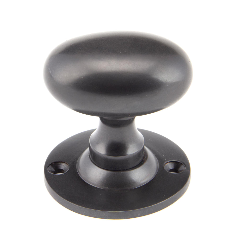 White background image of From The Anvil's Aged Bronze Oval Mortice/Rim Knob Set | From The Anvil