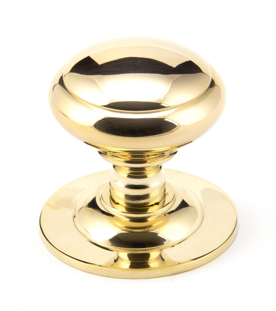 White background image of From The Anvil's Polished Brass Round Centre Door Knob | From The Anvil