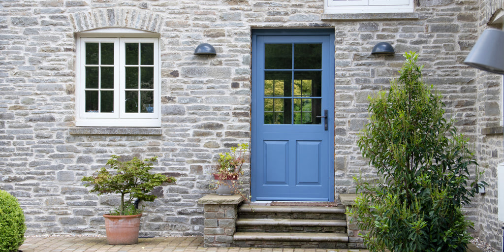 Blue painted exterior door with a slimline From The Anvil Black door handle.