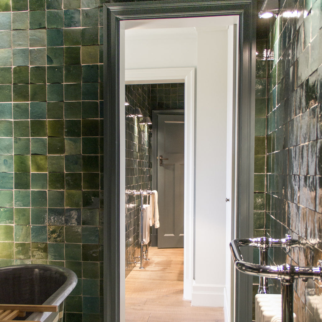 Green mosaic tile bathroom.