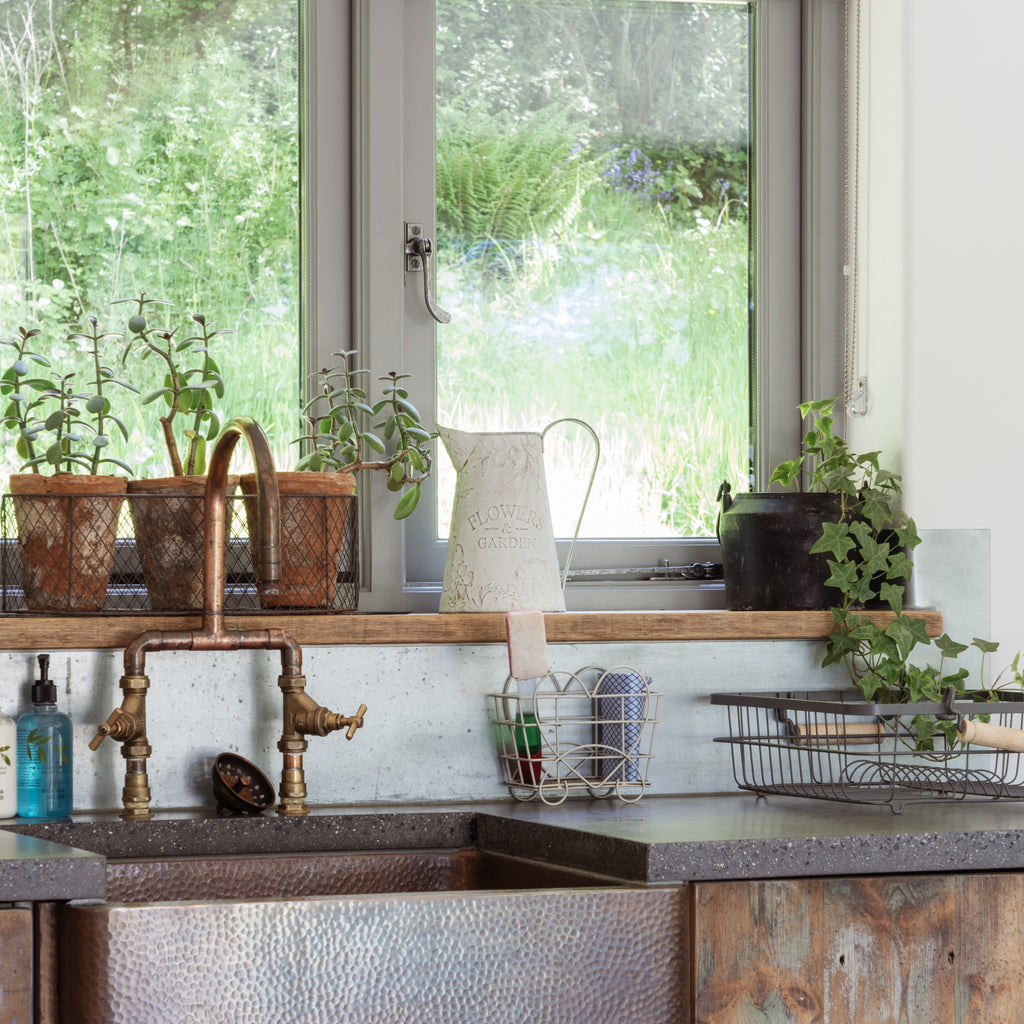 Rustic kitchen with Pewter From The Anvil hardware.