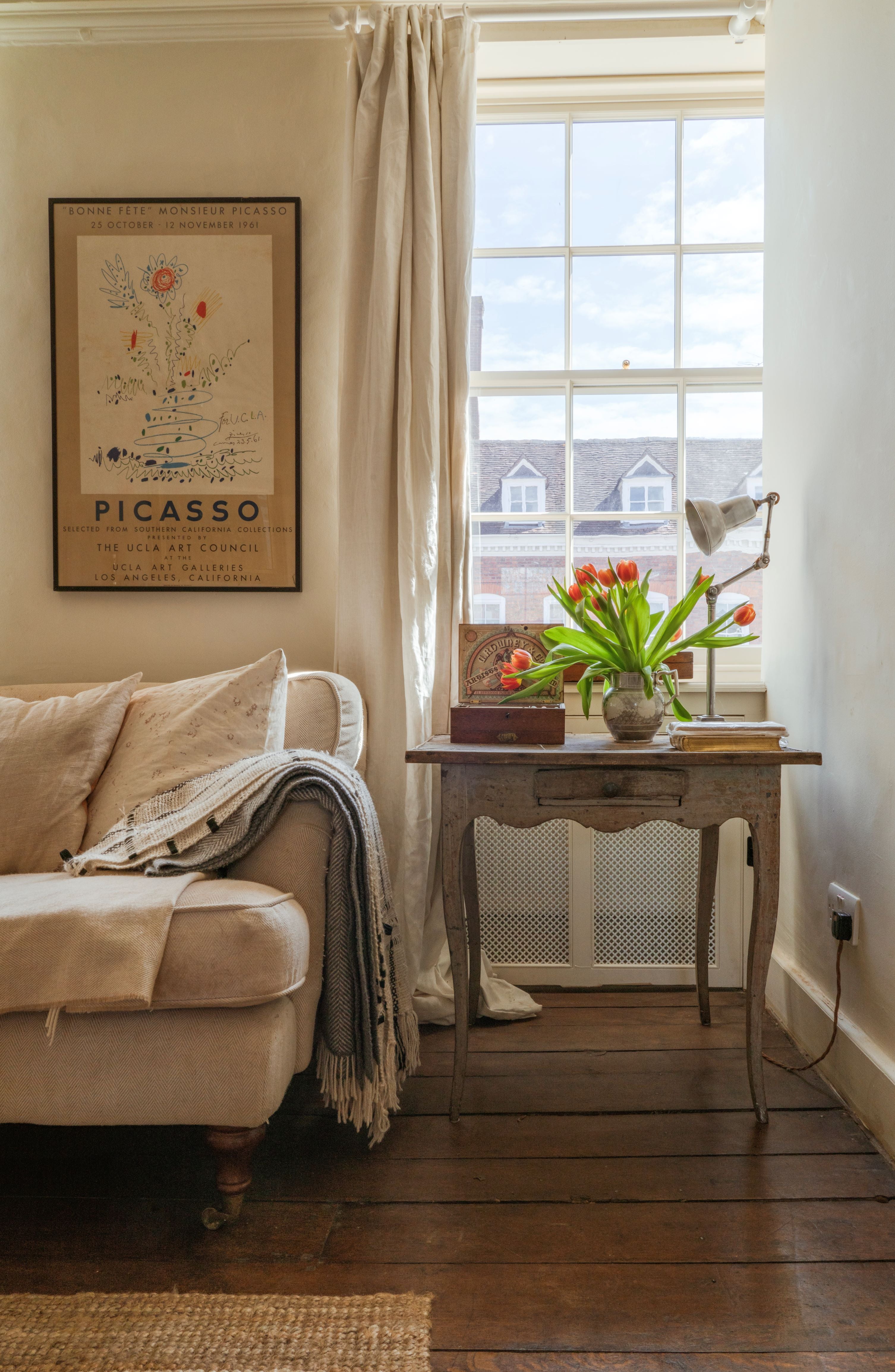 Period property interior with antique furniture and various decor.