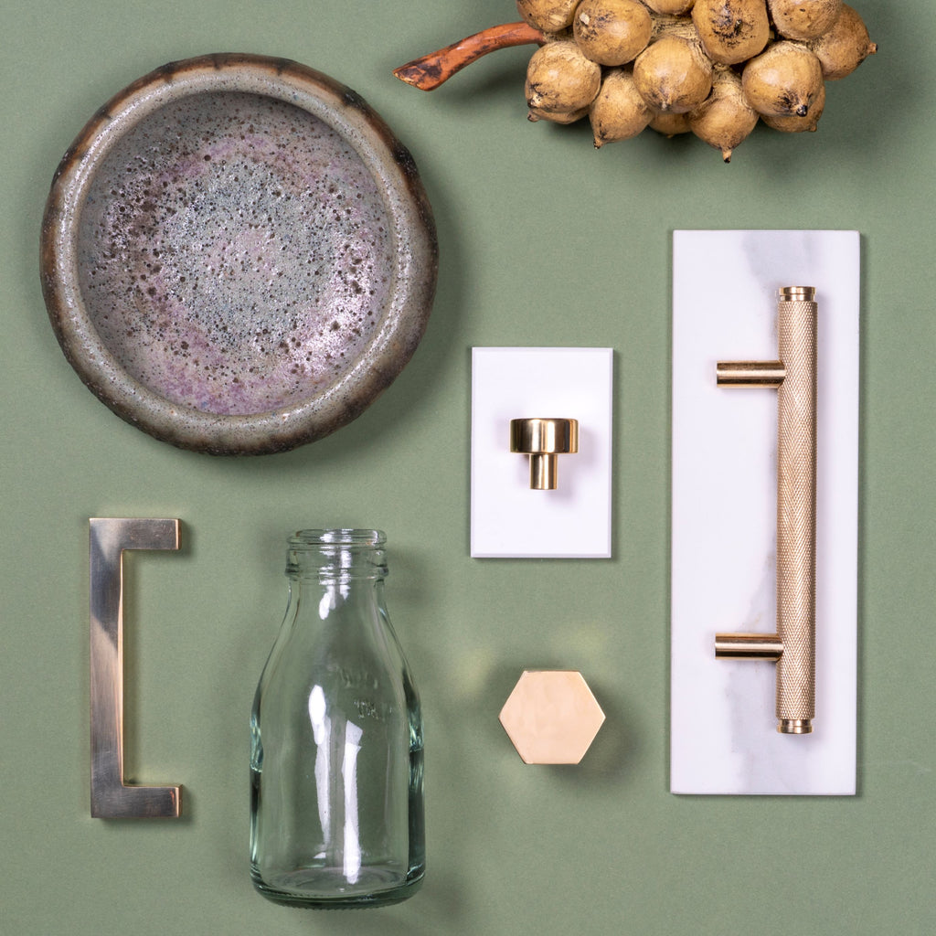 Moodboard of From The Anvil's Polished Brass cabinet knobs and pull handles.